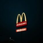 a mcdonald's restaurant sign lit up at night