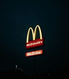 a mcdonald's restaurant sign lit up at night