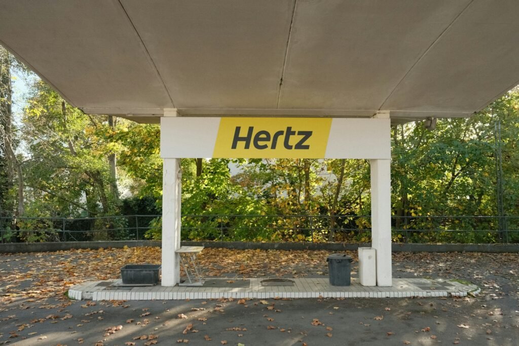 Hertz Offers Renters Discounted EVs Amid Struggles with Fleet Electrification Plans 1 a sign on a covered area