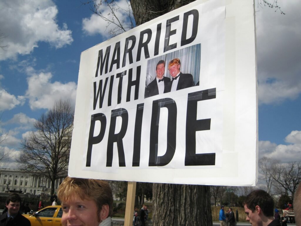 Idaho House Votes to Challenge Same-Sex Marriage Ruling, Ignites Uproar Among LGBTQ+ Advocates 1 Married with Pride signage
