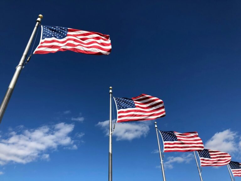 Former Executive Sentenced to 13 Months in $1.6 Million Insider Trading Scheme 8 U.S. American flags under clear sky