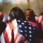 woman with US American flag on her shoulders, Mississippi