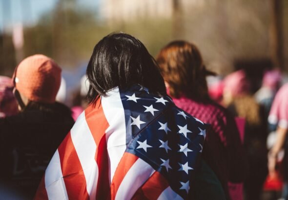woman with US American flag on her shoulders, Mississippi