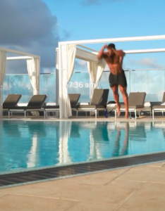 Ashton Hall diving into a pool