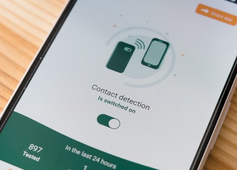 white and green box on brown wooden table