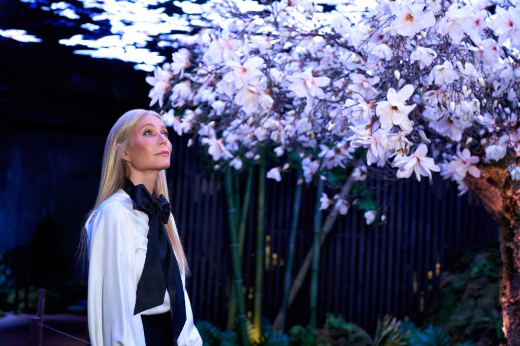 Gwyneth Paltrow and Genesis Create a Serene Escape in NYC with "The Forest Within" Immersive Retreat 4 Gwyneth Paltrow standing in front of a wall of flowers flowers