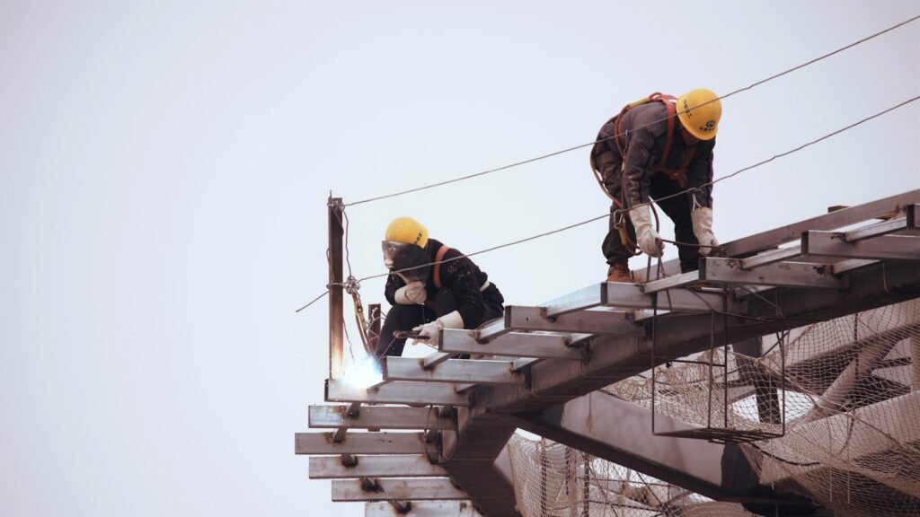 Attorney General Weiser Joins Multi-state Effort to Block Trump Administration’s Pause on Job Corps Program 1 man in black jacket and yellow hard hat standing on top of building during daytime