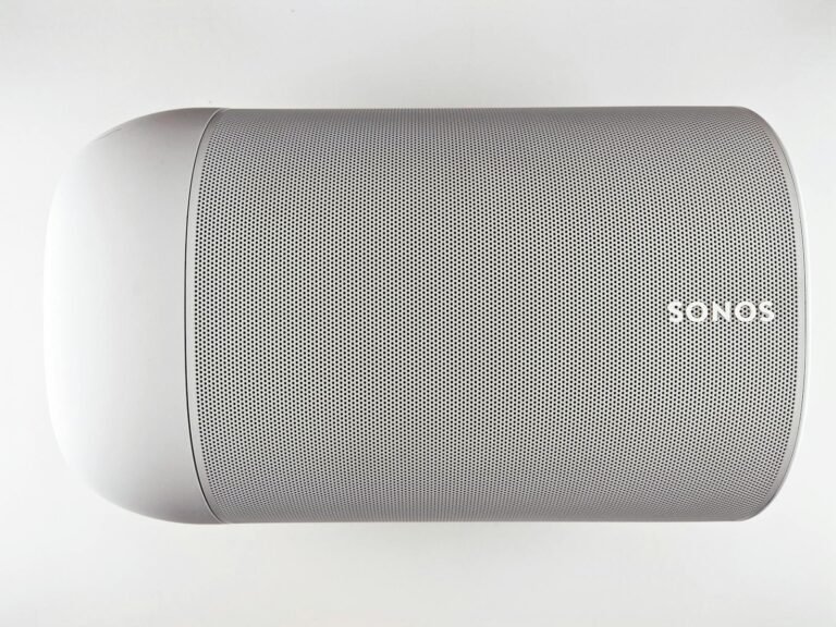 Sonos Users Push Back After App Update Breaks Speakers — Legal Action Underway 5 Top view of a sleek wireless speaker with a minimalistic design.