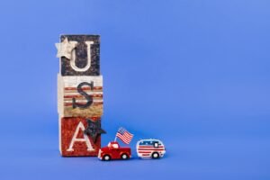 USA-themed wooden blocks with toy car and camper, perfect for Independence Day decor.