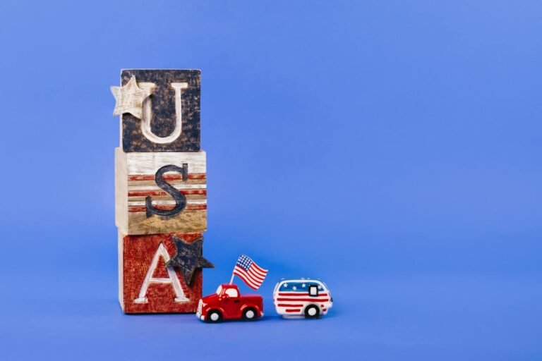 USA-themed wooden blocks with toy car and camper, perfect for Independence Day decor.