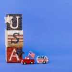 USA-themed wooden blocks with toy car and camper, perfect for Independence Day decor.