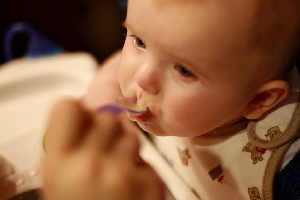 Similac and Enfamil Under Fire: $495M Verdict Fuels Wave of Lawsuits Over Infant Formula's Link to Deadly Disease in Preemies 1 Anderson eating baby food