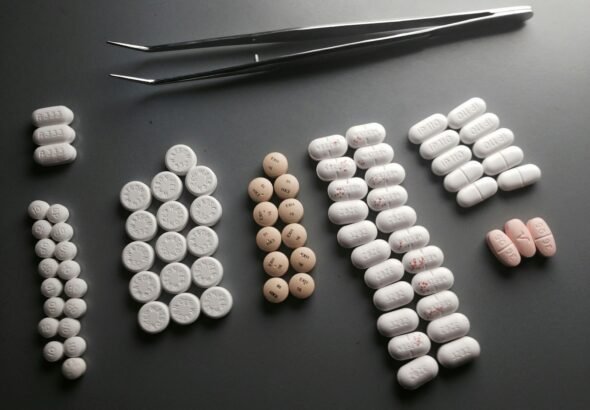 Federal Judge Bars Tampa-Area Pharmacist From Dispensing Opioids, Dissolves Pharmacy After CSA Violations 9 assorted-shape medication pill lot