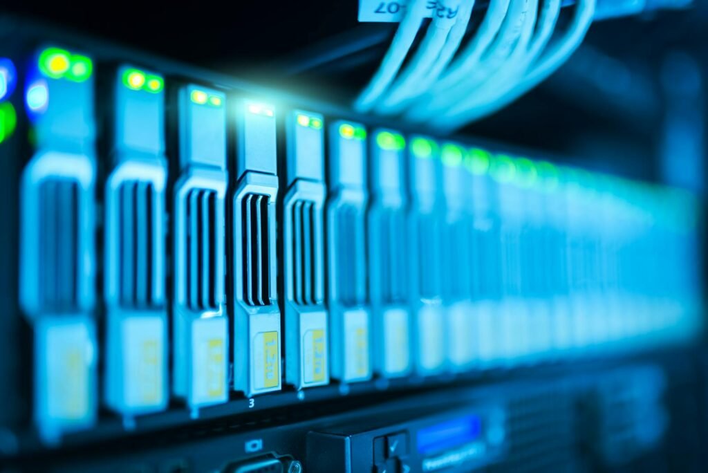 NAACP Opposes Massive Bessemer Data Center Over Environmental, Equity Concerns 1 Detailed image of a server rack with glowing lights in a modern data center.