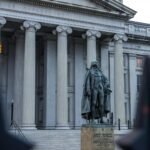 Statue of Albert Gallatin in front of the US Treasury Department building in Washington, DC.