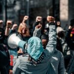 people standing and taking photo during daytime, justice, civil rights