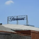 Paramount studios' sign stands against the blue sky.
