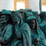 Sculpture of distressed people in a crowd, federal workers, officers, crime, federal, employees
